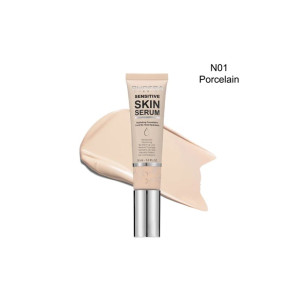 Tube of Sensitive Skin Serum foundation with shade N01 Porcelain, placed over a beige makeup swatch.