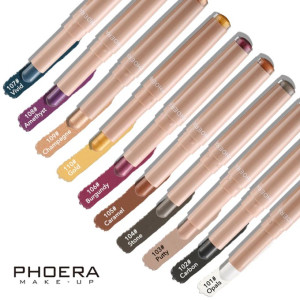 Row of Phoera makeup lip pencils swatched in 10 shades with color names: Opals, Carbon, Putty, Stone, Caramel, Burgundy, Gold, Champagne, Amethyst, Vivid.